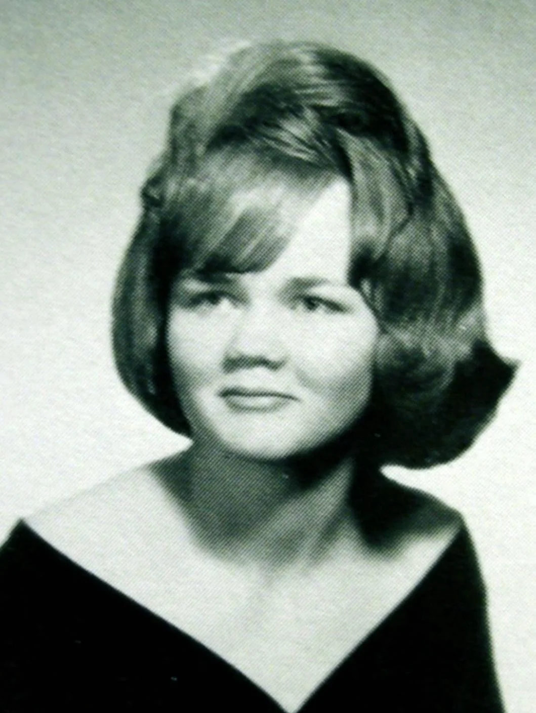 Black-and-white photograph of Darlene Ferrin, a smiling young woman with styled hair, taken around 1969, known as a waitress and mother killed at Blue Rock Springs.